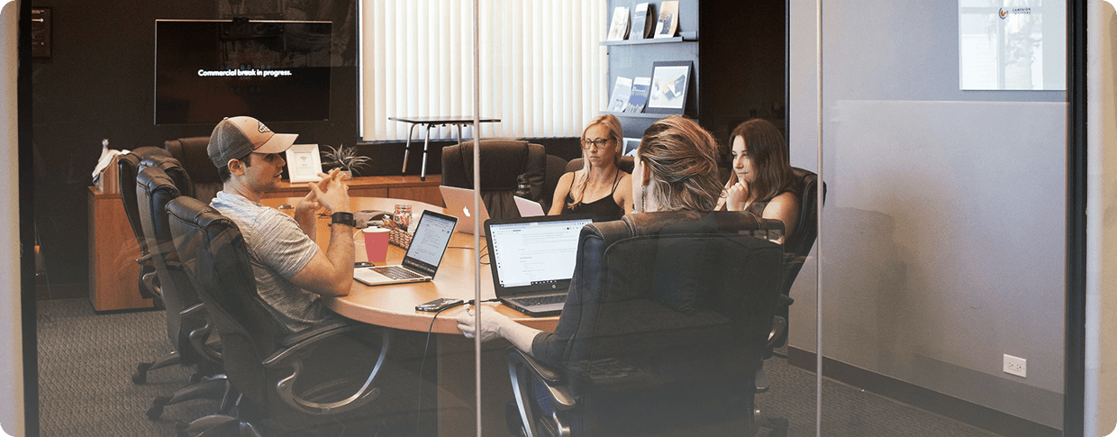 Novatore team in a meeting while a colleague presents
